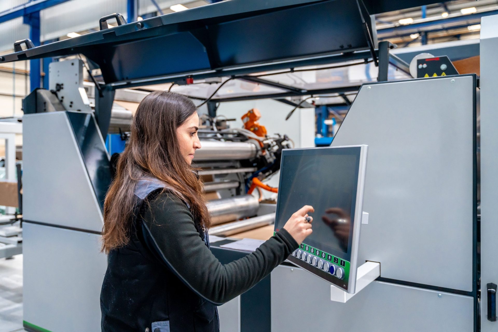 worker using cnc machine to control an industrial 2024 01 05 20 46 13 utc1 min scaled