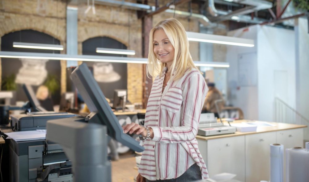 blonde woman choosing paper printing settings smi 2024 10 18 03 54 23 utc min scaled