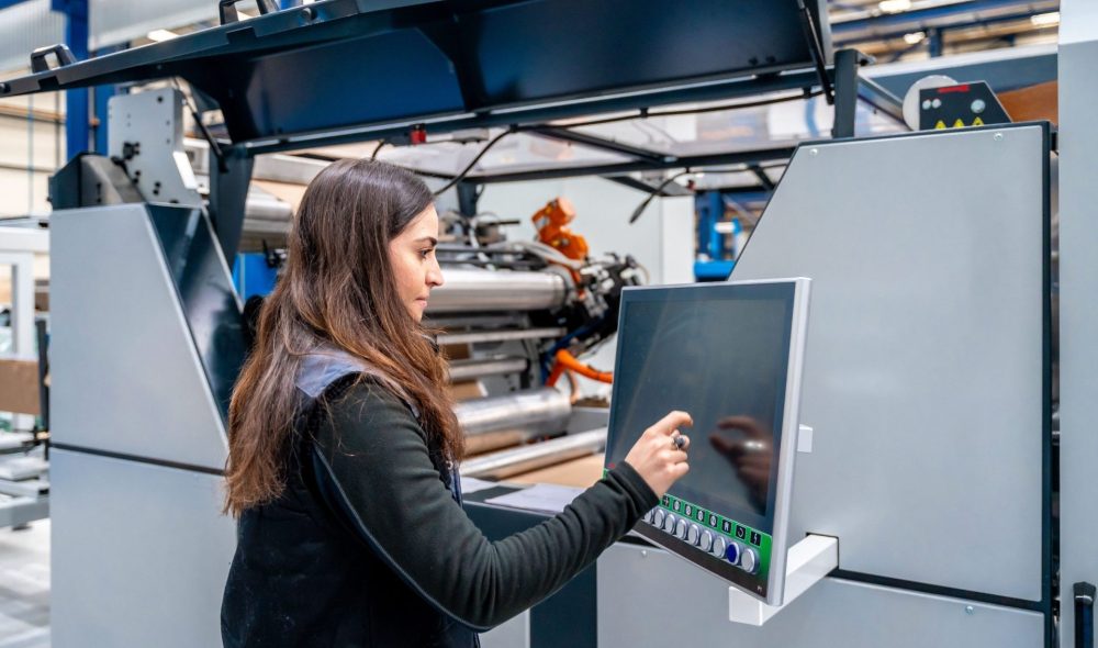 worker using cnc machine to control an industrial 2024 01 05 20 46 13 utc1 min scaled